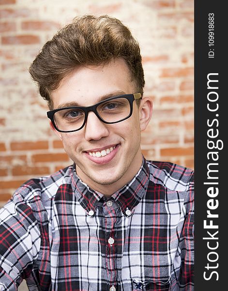 Man Wearing Eyeglasses And Smiling