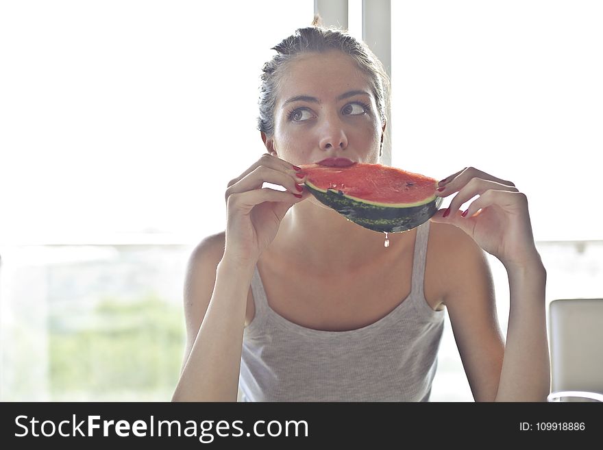 Woman in Gray Tank Top Holding Watermelon