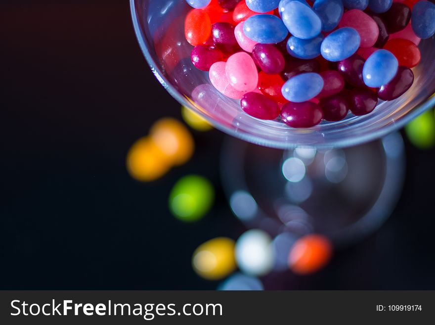 Selective Focus Photography of Jelly Beans on Jar