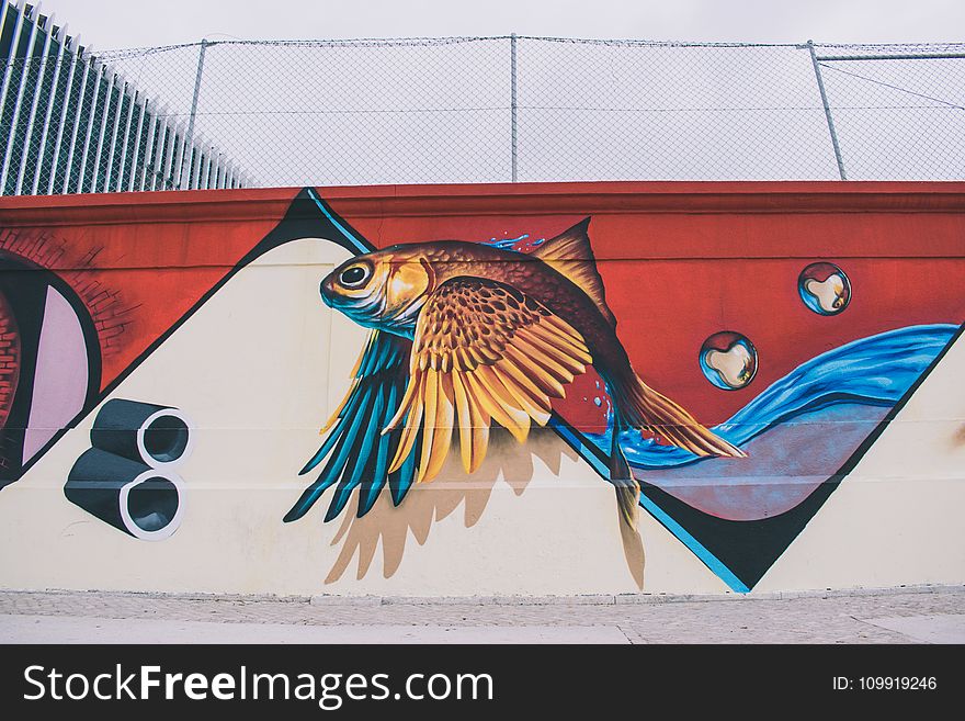 Photo Of Brown, Blue, Red, And White Fish With Wings Wall Painting