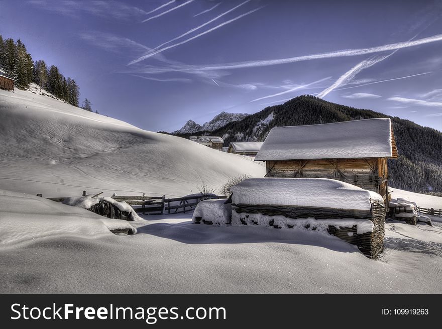 Brown Wooden House Covered With Snow