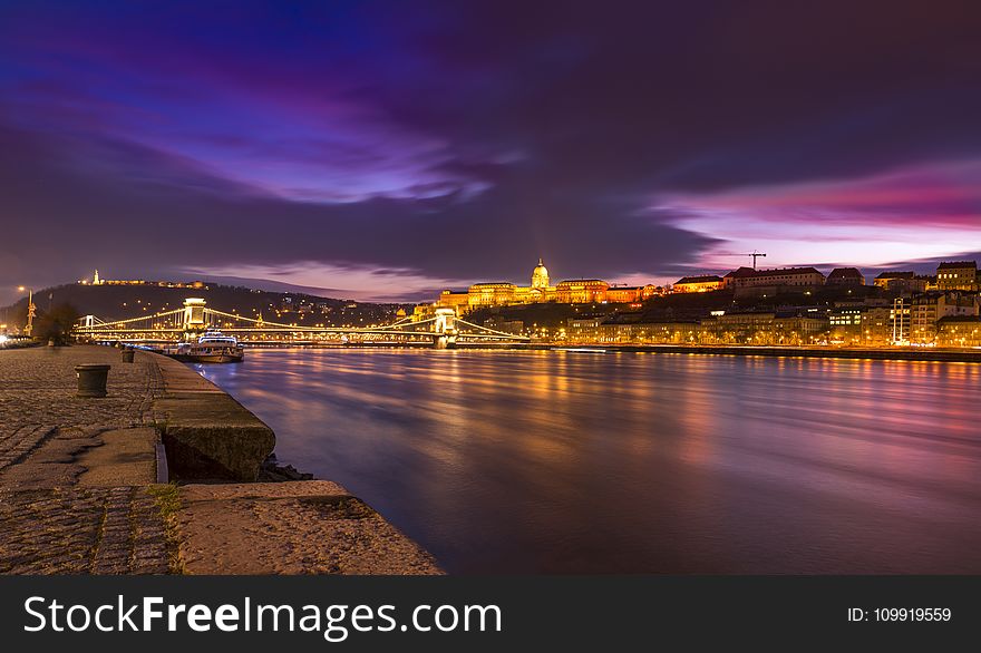 Town Near River During Night Time