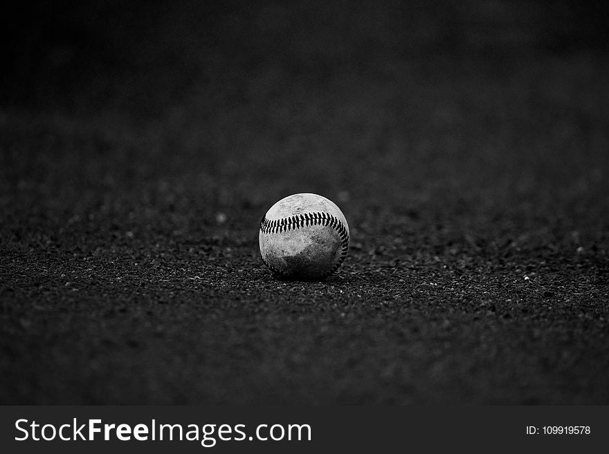 Selective Focus Grayscale Photography of Baseball