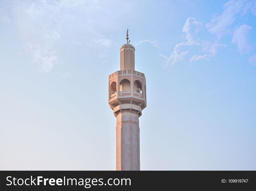 Low Angle Photography Of Brown Concrete Tower