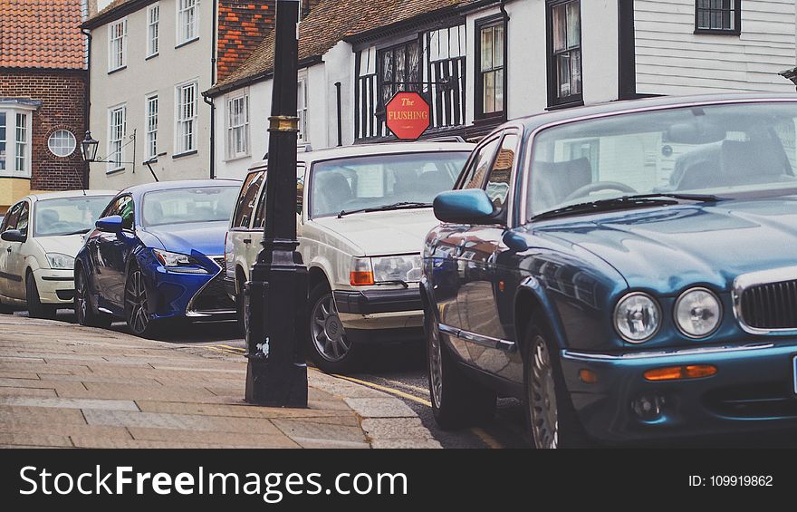 Four Car Parked Beside the Road