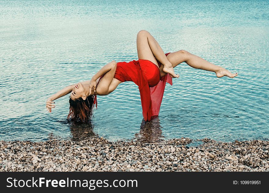 Woman Wearing Red Dress Floating