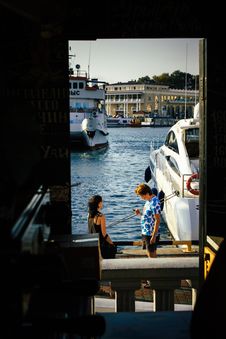 Free Man Standing Beside Woman Near White Yacht Stock Image - 109920521