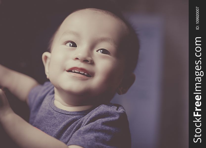 Close-Up Photography of a Smiling baby