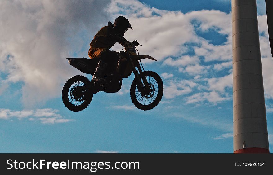 Man Riding Motocross Dirt Bike