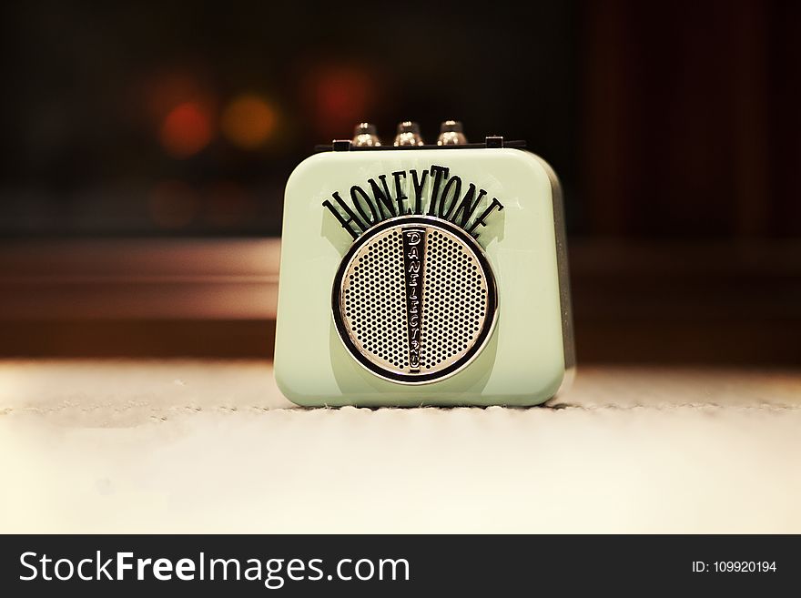 Selective Focus Photography of Honey Tone Mini Amp