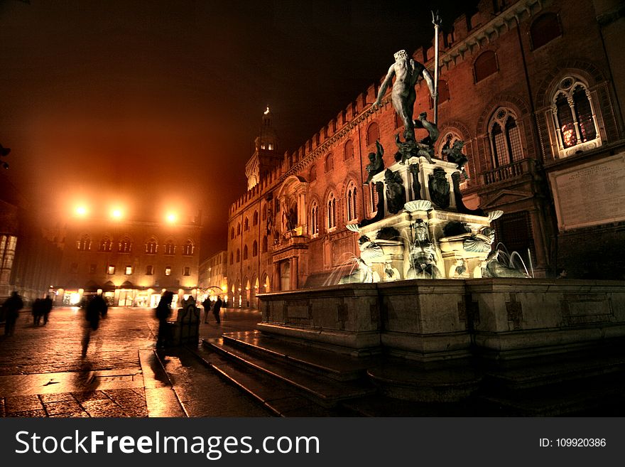 Monument With Water Fountain During Nighttime