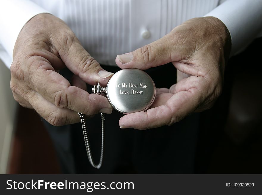 Person Holding Silver-colored Pocket Watch