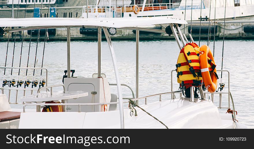 Photo Of White Boat With Life Vest On Side