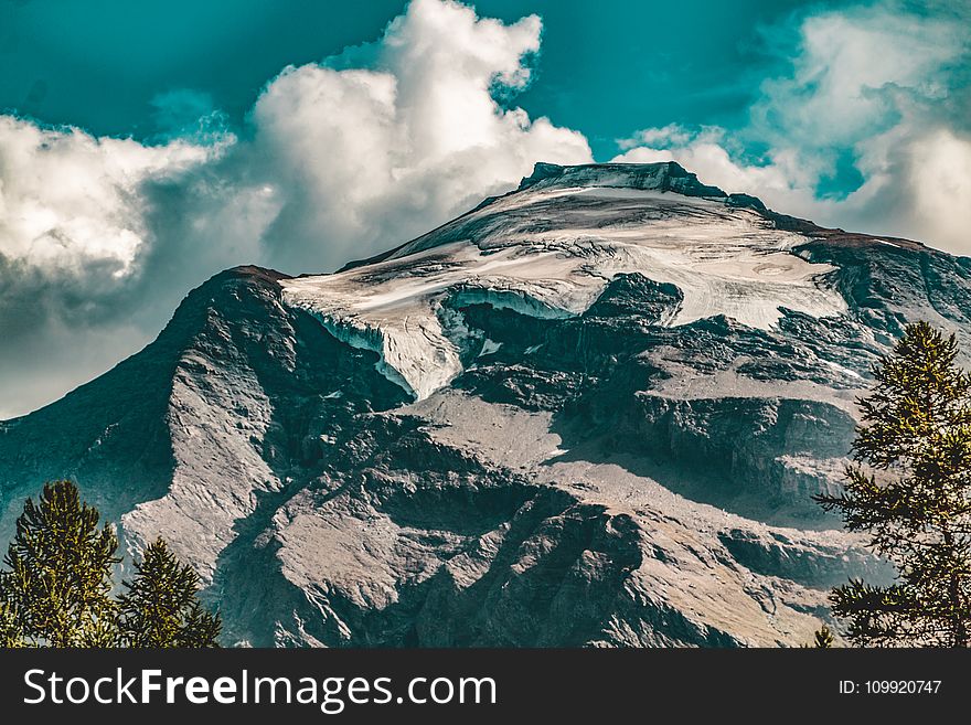 Rocky Mountain Under Blue Cloudy Sky