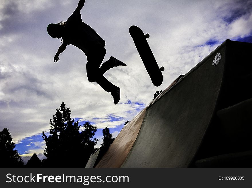 Silhouette Photo Of Person Doing Skateboard
