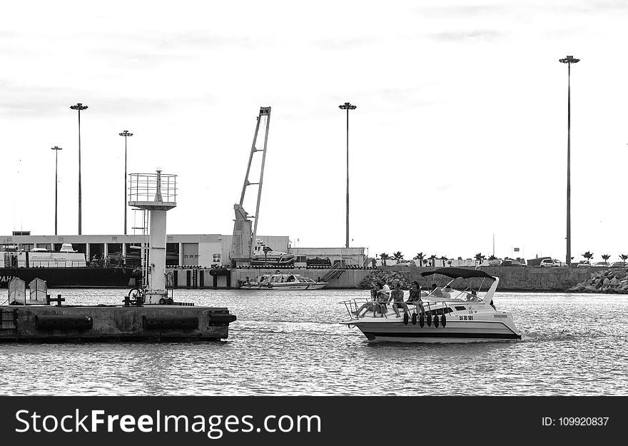 Grayscale Photo Of People Riding On Yacht