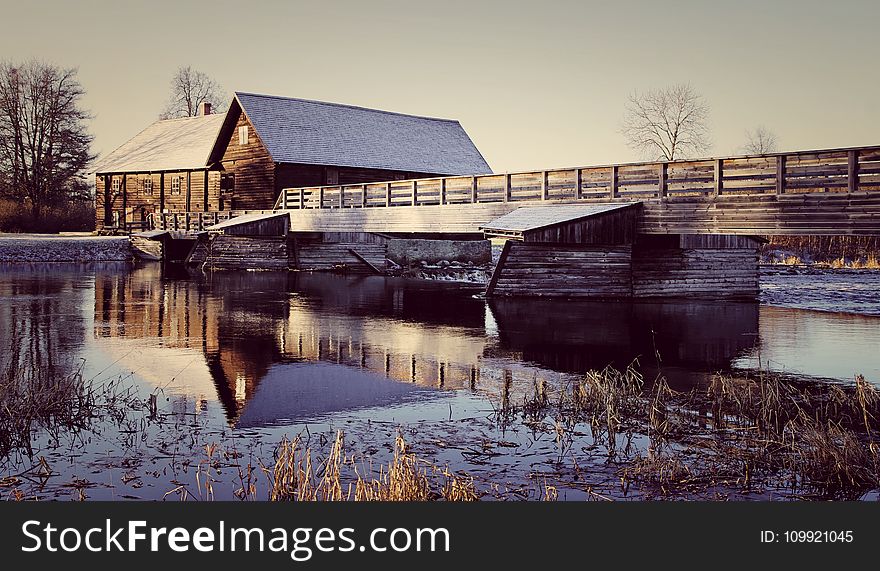 Photo of Wooden House Near the River