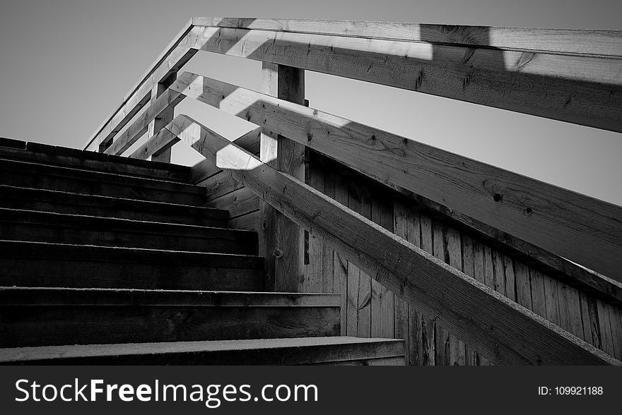 Grayscale Photo of Wooden Stairs
