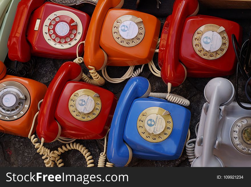 Seven Assorted Colored Rotary Telephones