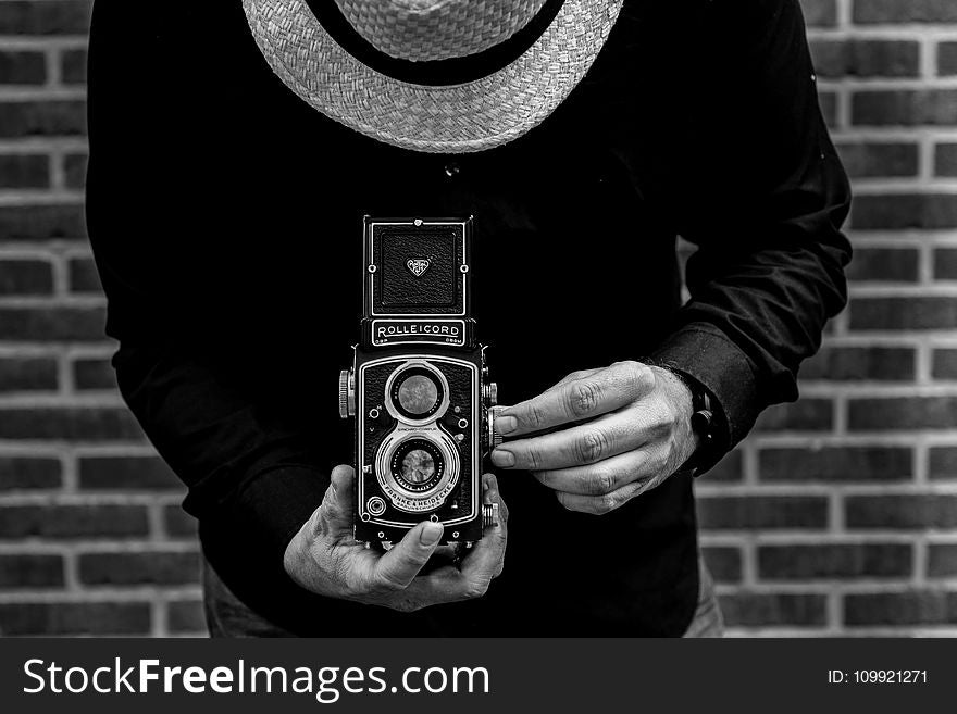 Photo of Person Holding Vintage Camera