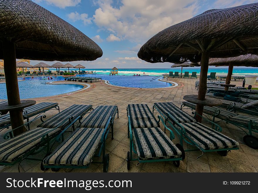 Bunch Of Sun Lounger Near Pool