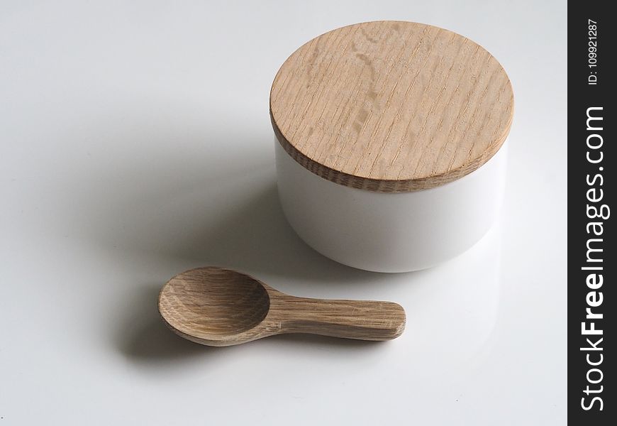 Close-up Photography of White and Brown Wooden Container and Spoon