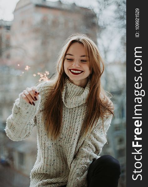 Woman Wears White Knit Turtleneck Long-sleeved Shirt With Blonde Hair