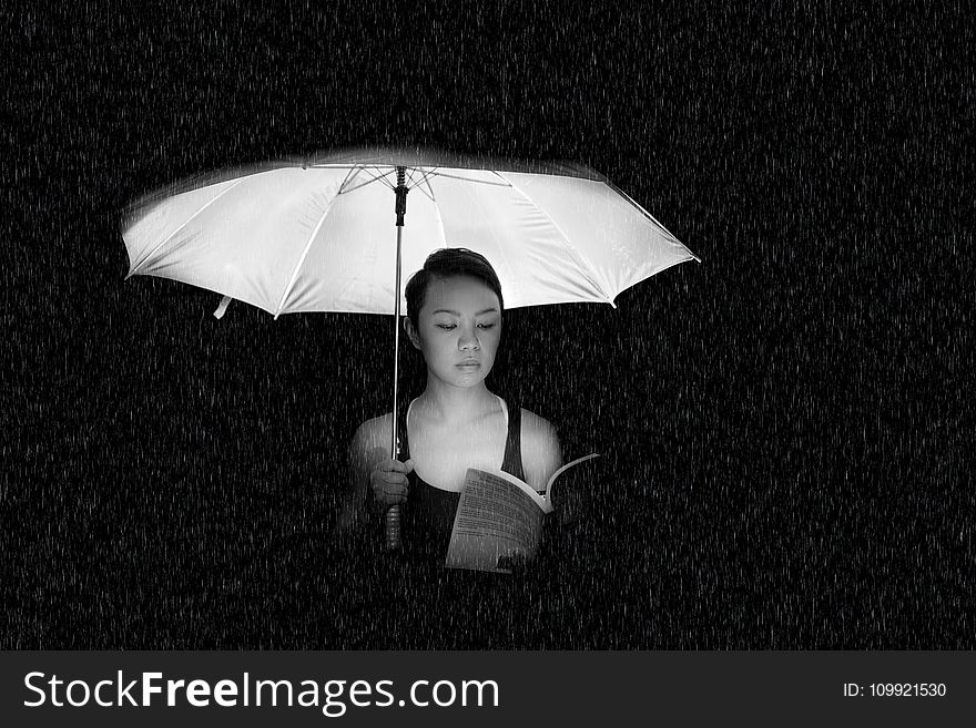 Woman Holding an Umbrella Greyscale Photo