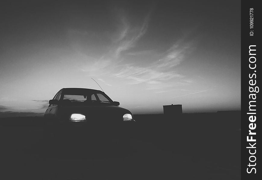 Silhouette Of Car With Turned On Light