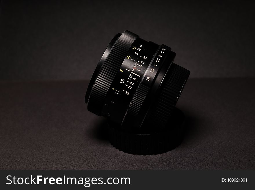 Black Camera Lens on Black Textile