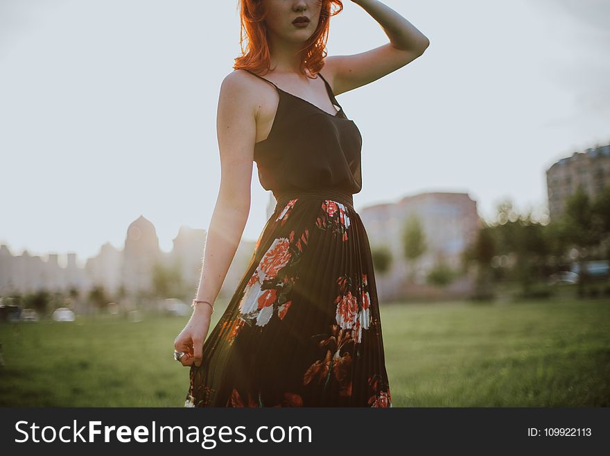 Photography of Woman in Black Spaghetti Strap Dress