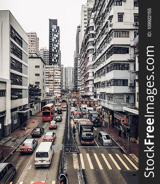 Photography of Buildings and Cars on Road
