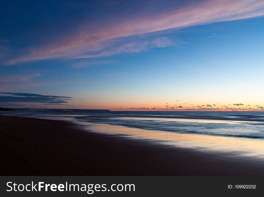 Time Lapse Photo Of Seashore During Golden Hour