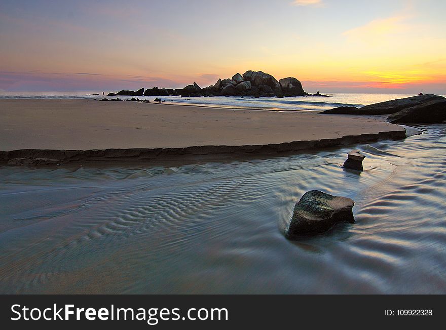 Scenic View Of Ocean During Dusk