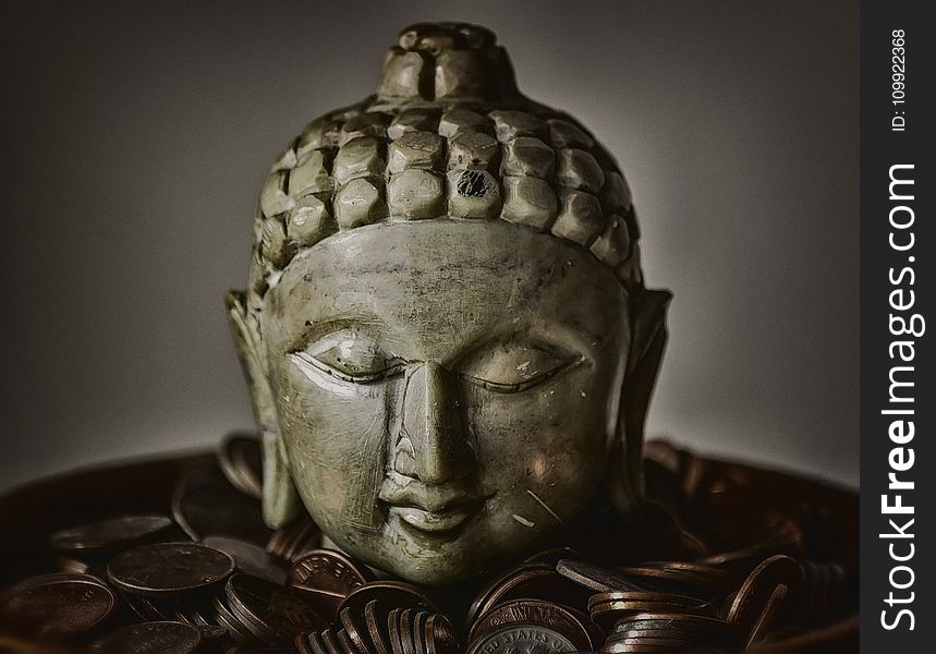 Gautama Buddha Bust Surrounded By Coins