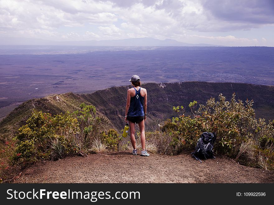 Photography Of A Woman Wearing Blue Tank Top