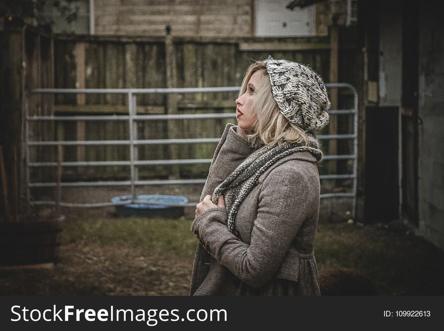 Woman Wearing Gray Hoodie and Knit Cap