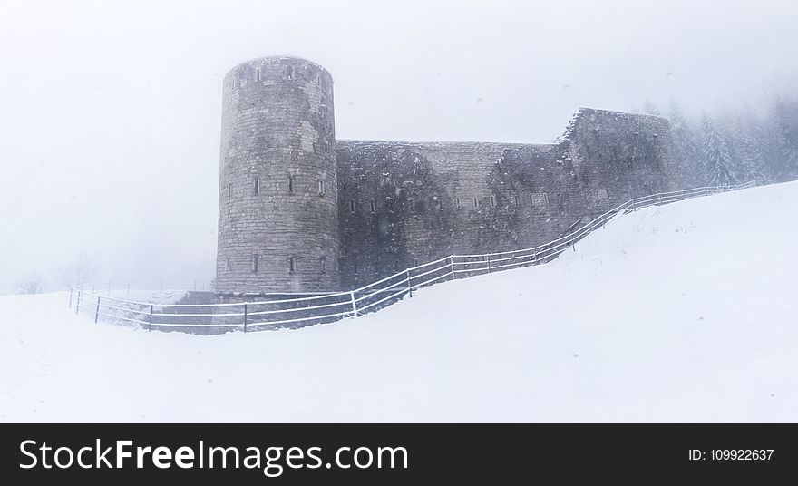 Gray Castle on Snowy Place
