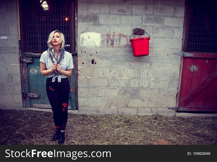 Woman in Gray Button-up Shirt and Black Pants