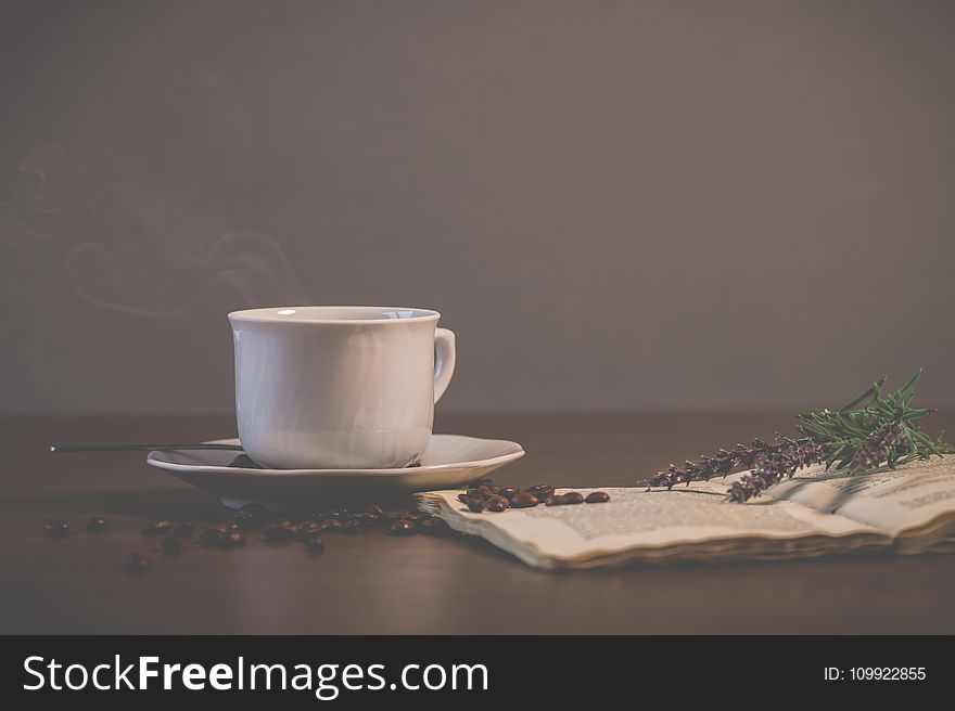 White Ceramic Teacup With Saucer