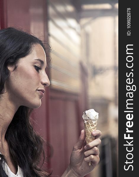 Photography of a Woman Holding Ice Cream