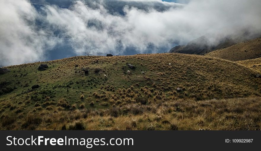 Green Hill Covered by Clouds