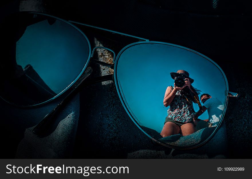 Reflection Of People On Sunglasses