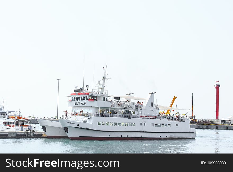 White Commuter Boat on Body of Water