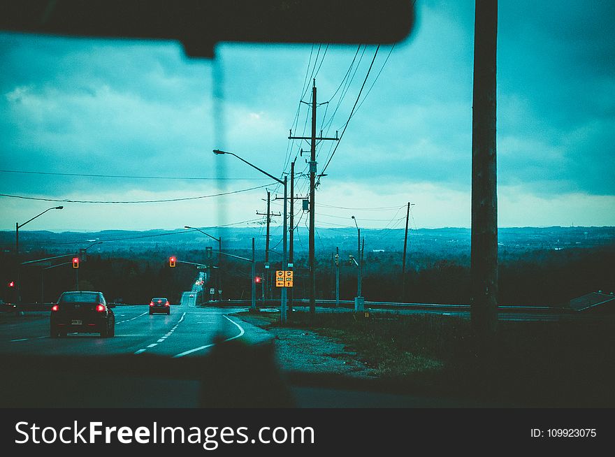 Road With Light Posts From Inside Car&x27;s Point Of View