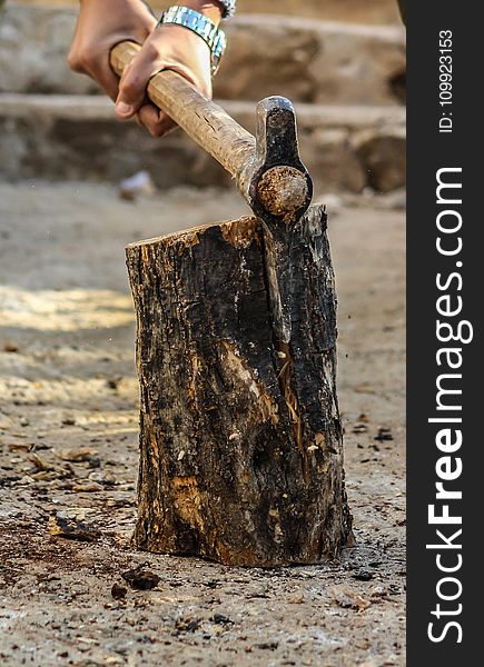 Photography of a Person Chopping Wood