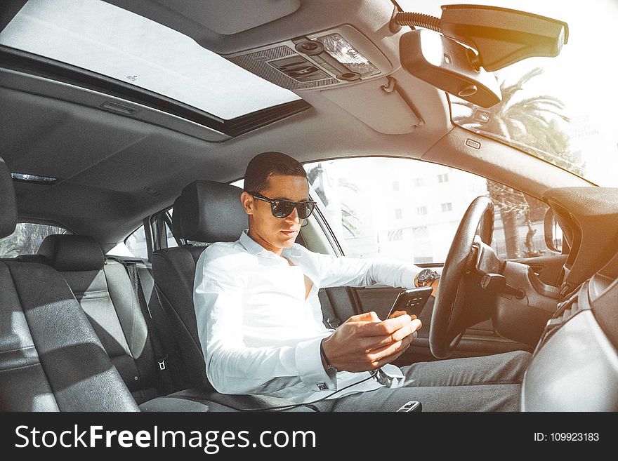 Man In White Dress Shirt Holding Smartphone