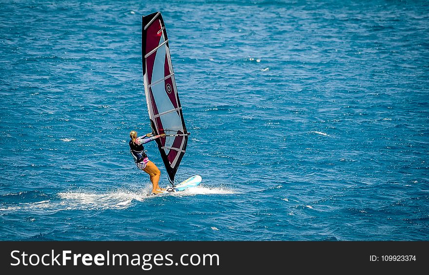 Person Doing Surfboarding