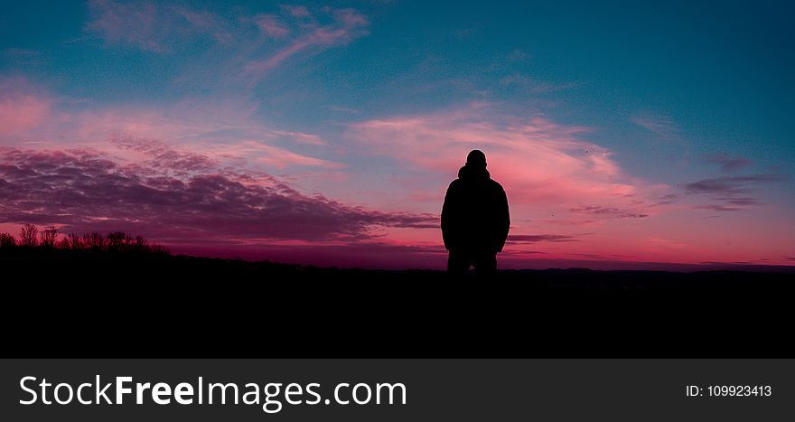 Silhouette of Human With Sunset Background
