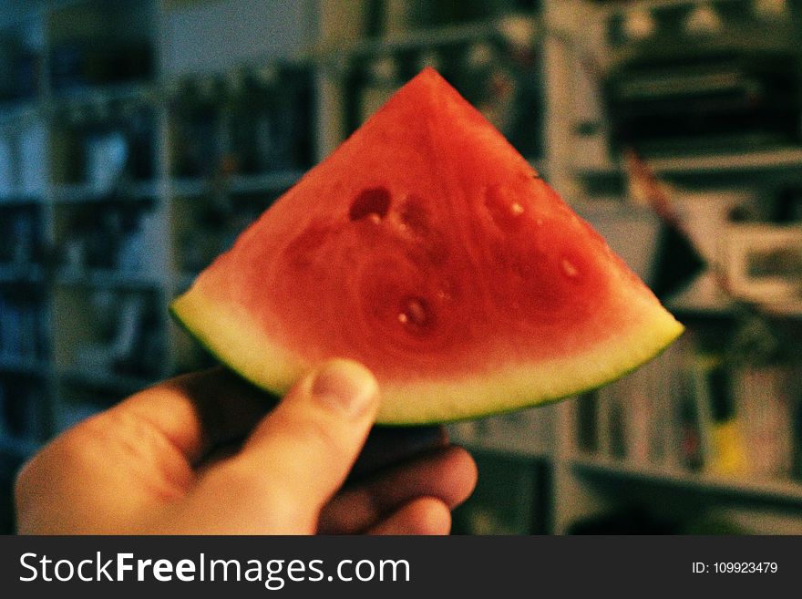 Person Holding Sliced Watermelon